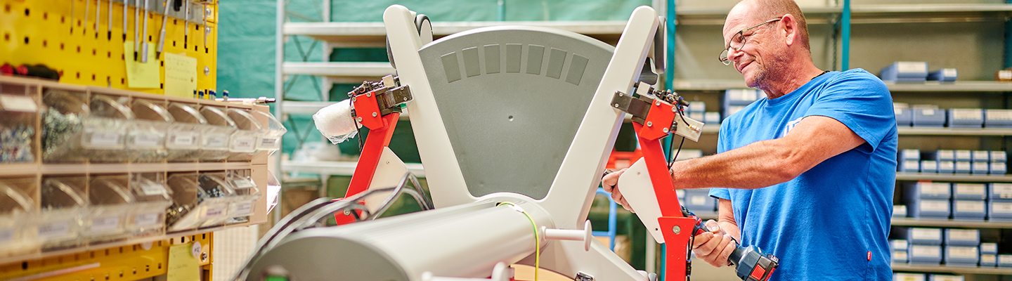 Worker assembling a medical cart